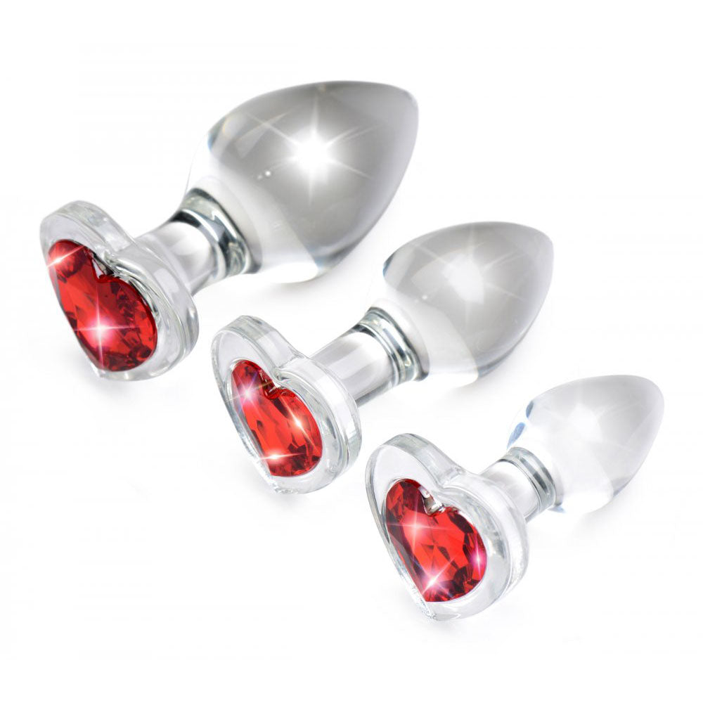 Three jeweled butt plugs in different sizes displayed together, showing how a small collection can offer variety and progression